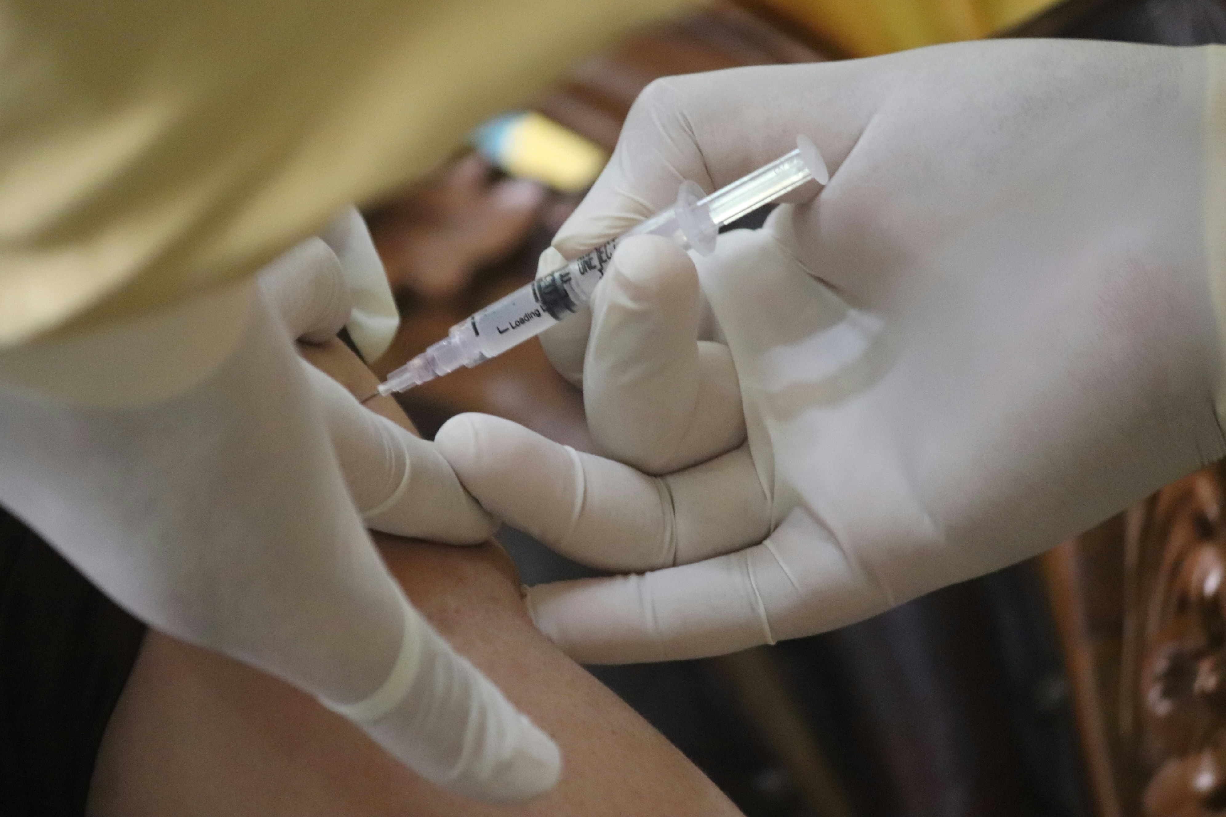 Flu vaccination being administered